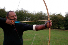 Mark Turner with his longbow. Split second before shooting.